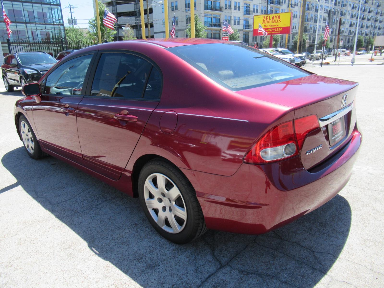 2009 Red /Tan Honda Civic LX Sedan AT (19XFA16529E) with an 1.8L L4 SOHC 16V engine, Automatic Overdrive transmission, located at 1511 North Shepherd Dr., Houston, TX, 77008, (281) 657-1221, 29.798361, -95.412560 - 2009 HONDA CIVIC LX VIN: 19XFA16529E042917 1 9 X F A 1 6 5 2 9 E 0 4 2 9 1 7 SEDAN 4 DR 1.8L I4 F SOHC 16V GASOLINE FRONT WHEEL DRIVE - Photo #14
